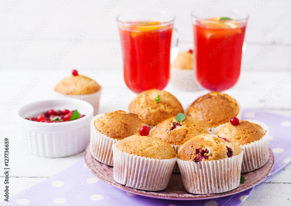 Tasty muffin (cupcake) with cranberries and cranberry-orange drink. Tasty muffin (cupcake) with cranberries and cranberry-orange drink.
