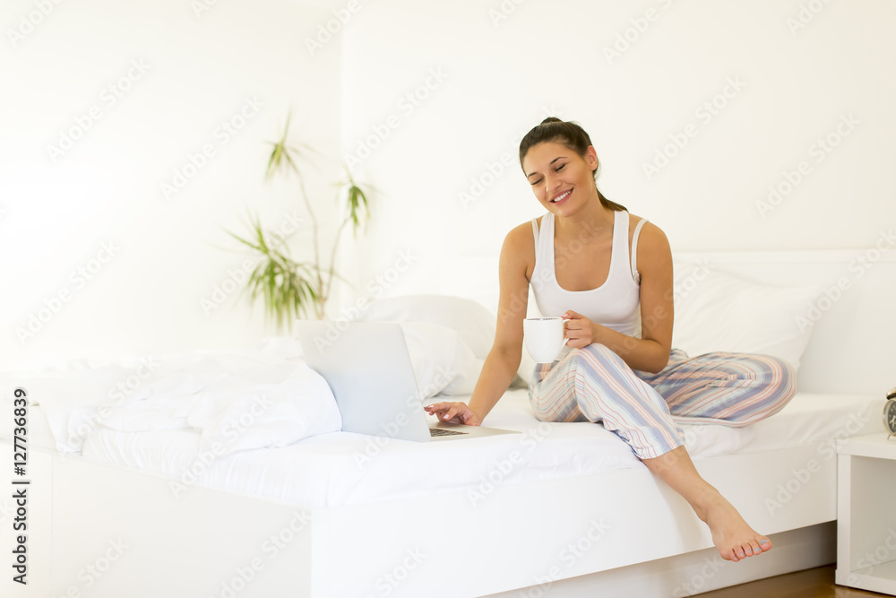 Woman in white bed
