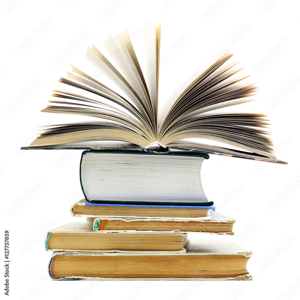 Naklejka premium Stack of old books isolated on a white background