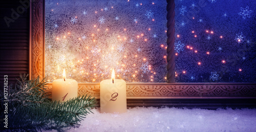 2. Advent, zwei Kerzen im Fenster als Fensterschmuck photo