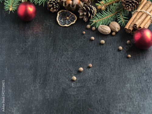 Christmas background with spices, fir branches and cones