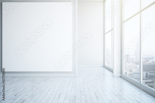 White wooden interior with blank frame