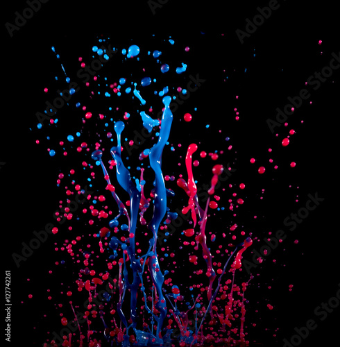 Аbstract sculptures of colorful splashes of paint. Dancing liquid on a black background. Ink water splash. Color explosion.
