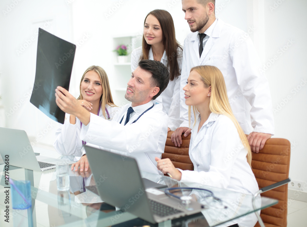 Portrait of confident happy group of doctors working at the medi Portrait of confident happy group of doctors working at the medi