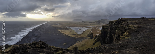 Most beautiful black sands beach of Vik in Iceland - dramatic wide panorama