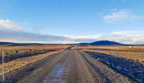 Traveling down the gravel road in desert, Kjolur Highland route F35 Volcanic Iceland © donvictori0