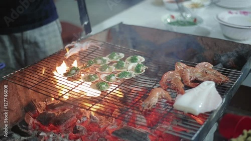 Seafood barbecue, shrimp and scallops on the grill delicious stall food selling vietnam