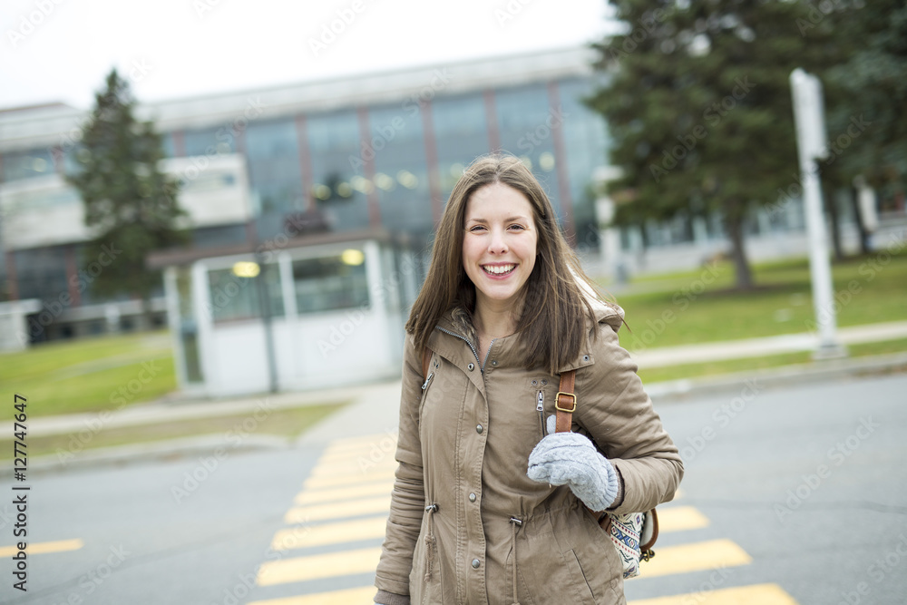 Fototapeta premium Portrait Of Female University Student Outdoors On Campus