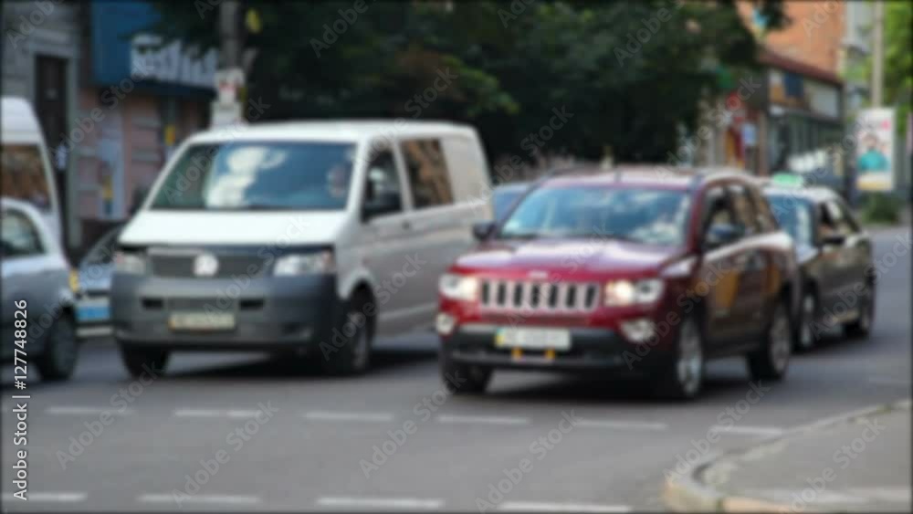 Cars driving on the urban road in rush hour. Blurs Cars driving on the urban road in rush hour. Blurs