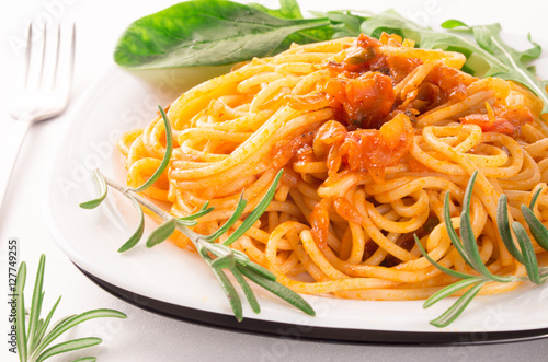 Italian spaghetti with vegetable sauce and herbs