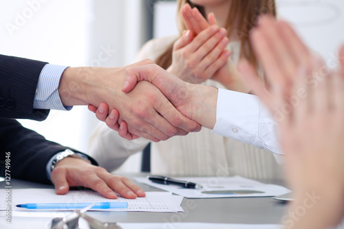 Close up of two business man shaking hands to each other finishing up the meeting