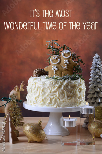 Festive Christmas white chocolate cake with gingerbread men cook