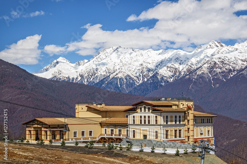 Luxurious Solis Sochi Hotel on a sunny mountain slope background beautiful scenery photo