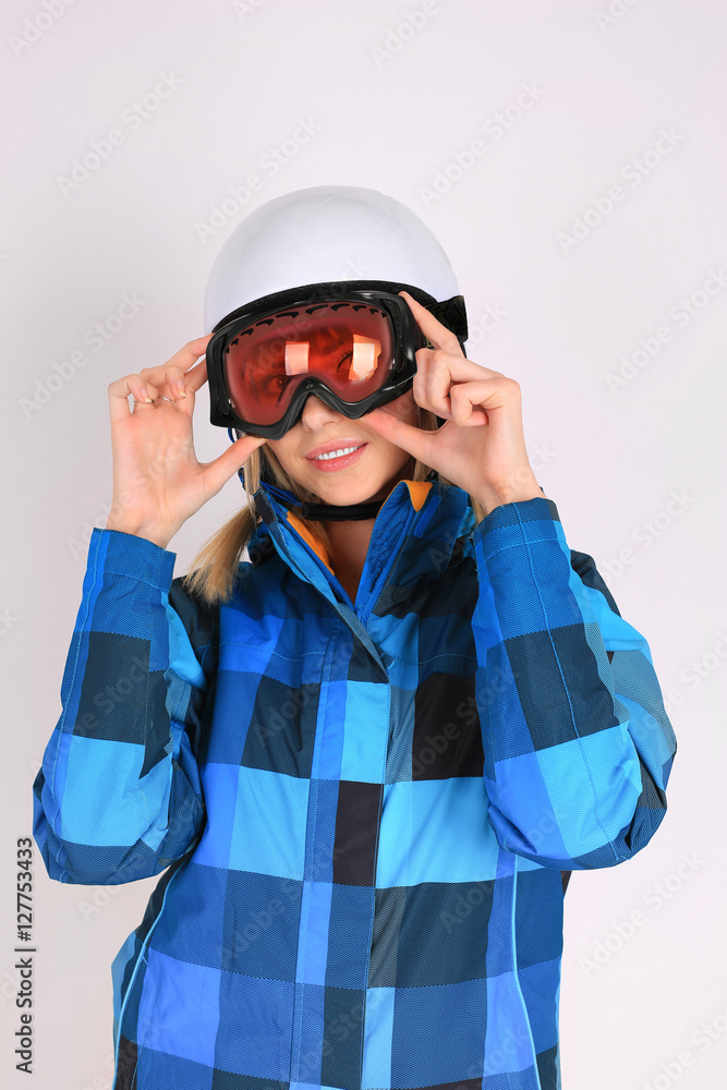Woman sexy hot skier or snowboarder girl ski googles holding hel Woman sexy hot skier or snowboarder girl ski googles holding hel