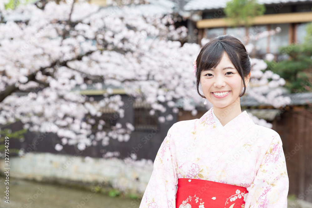attractive asian woman wearing kimono looking cherry blossoms attractive asian woman wearing kimono looking cherry blossoms