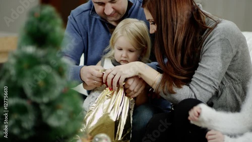 unhappy daughter at the celebration of christmas photo