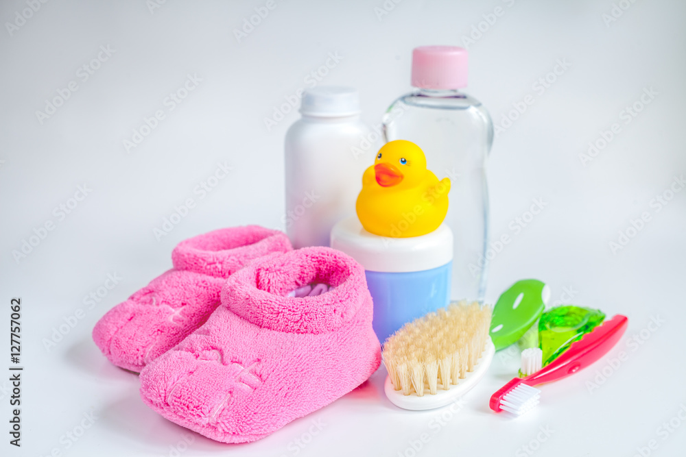 baby accessories for bath with duck on white background baby accessories for bath with duck on white background