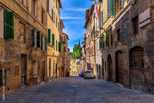 Medieval narrow street in Siena, Tuscany, Italy