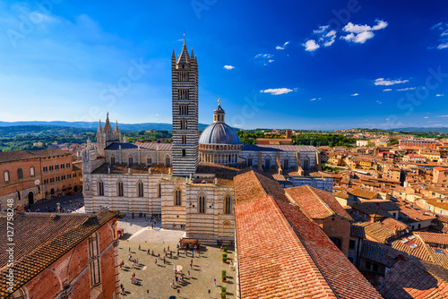 View of Siena Cathedral (Duomo di Siena) and Piazza del Duomo in Siena, Italy. photo