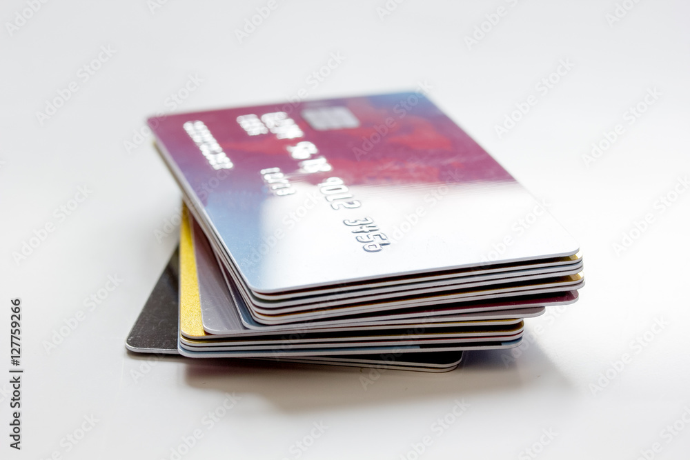 pile of credit cards on white background pile of credit cards on white background