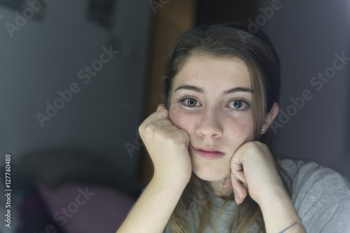 Portrait of teenage looking in a mirror