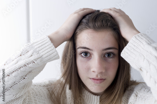 Portrait of adolescent with long chestnut hair