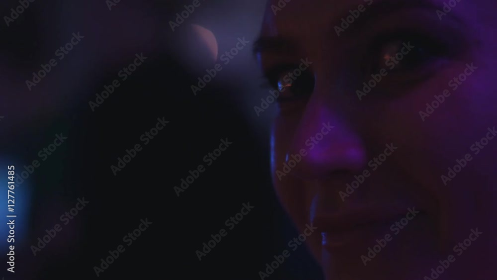 Face of young girl on party in nightclub. Dj at turntable. Saxophonist. Holidays. Performance Face of young girl on party in nightclub. Dj at turntable. Saxophonist. Holidays. Performance