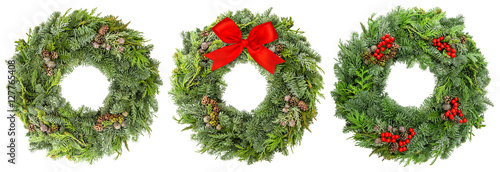 Christmas wreath pine spruce twigs cones berries ribbon bow photo