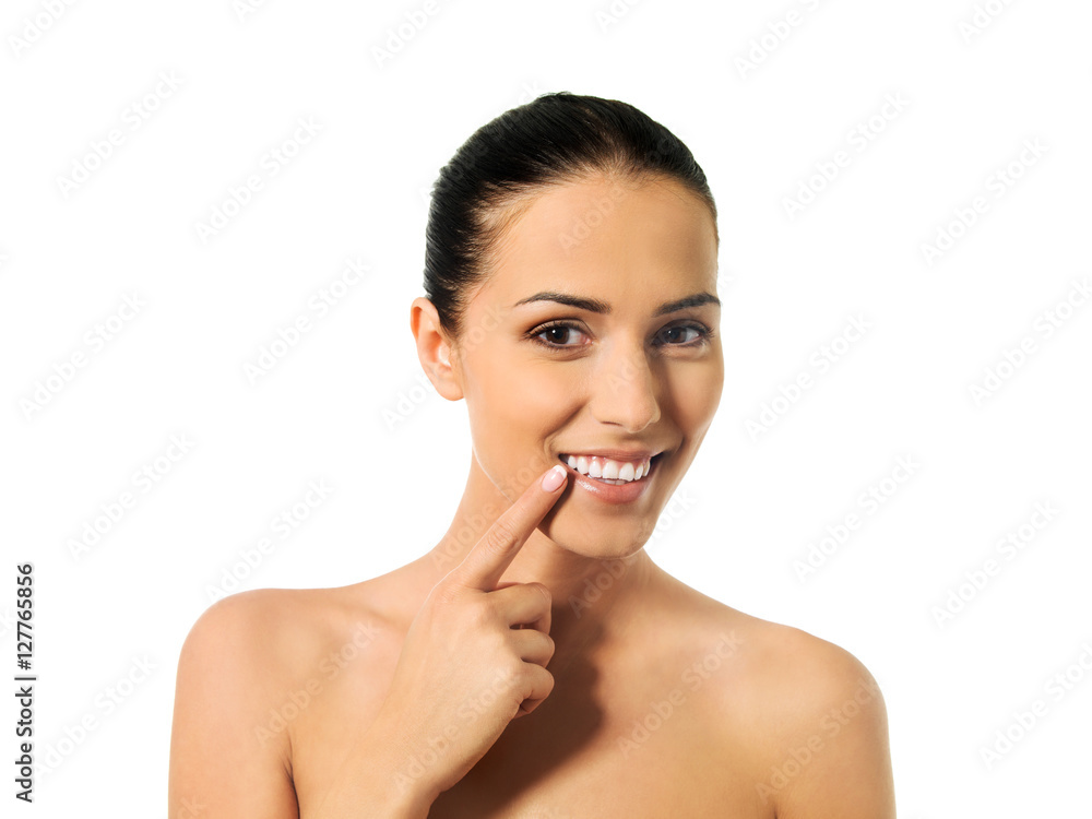 Dental health concept - beautiful woman pointing to her teeth Dental health concept - beautiful woman pointing to her teeth