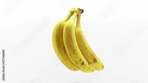 bunch of bananas suspended in the air rotates around in loop