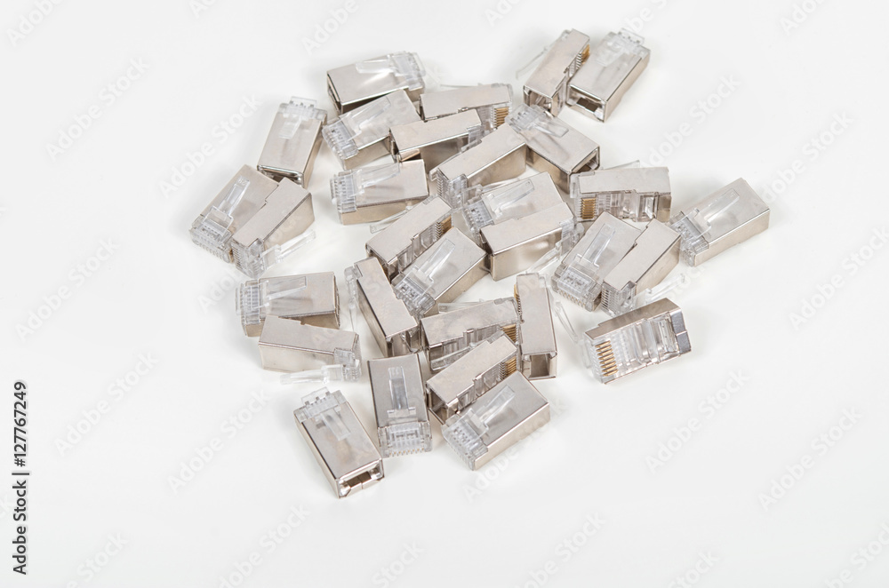 Bunch of CAT5e shielded ethernet connectors on white background Bunch of CAT5e shielded ethernet connectors on white background