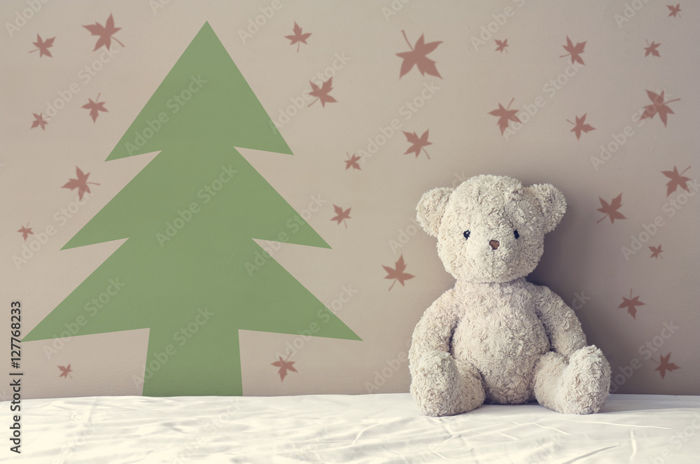Fototapeta premium vintage teddy bear sit on the right side white bed at headboard