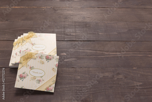 Notebooks with thank you message are on the wooden background