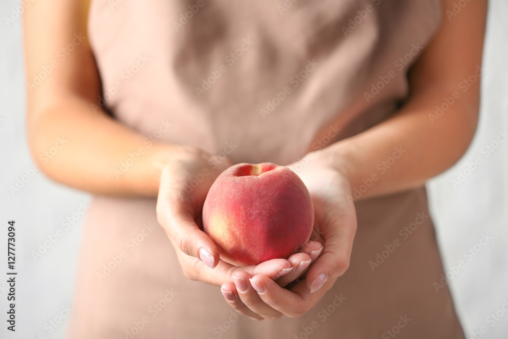 Woman holding fresh peach Woman holding fresh peach