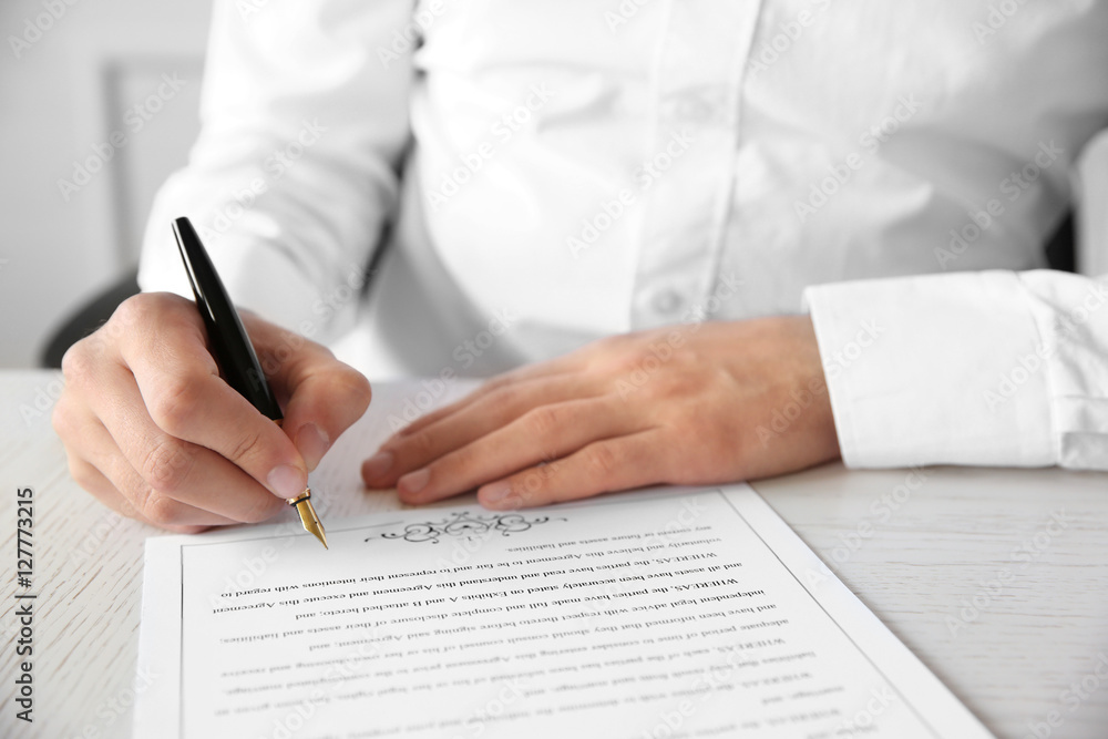 Man signing marriage contract, closeup Man signing marriage contract, closeup