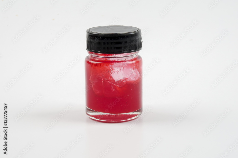 Red balm in a jar isolated over white Red balm in a jar isolated over white