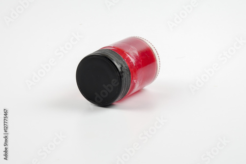 Red balm in a jar isolated over white