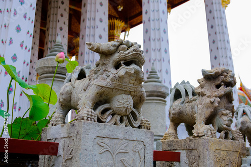 Detail of Lion Stone statue for Thai-Chinese style and thai art architecture in Wat Arun buddhist temple in Bangkok, Thailand.Photo taken on: 21 November , 2016