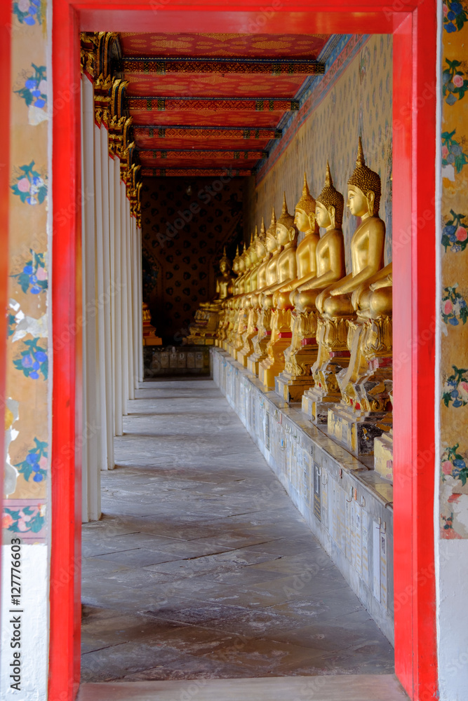 Row of Buddha gold  and thai art architecture in Wat Arun buddhist temple in Bangkok, Thailand.Photo taken on: 21 November , 2016