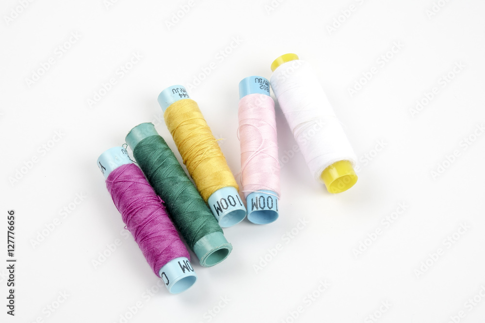 Sewing colored threads isolated on white background Sewing colored threads isolated on white background