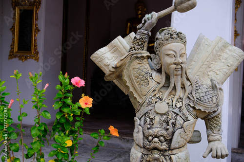 Detail of Stone statue for Thai-Chinese style  and thai art architecture in Wat Phra Chetupon Vimolmangklararm (Wat Pho) temple in Thailand. Photo taken on: 21 November , 2016 photo