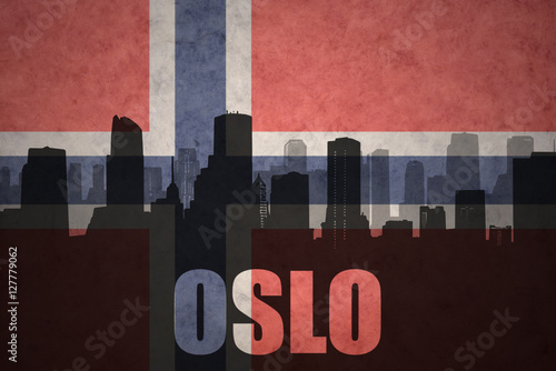 abstract silhouette of the city with text Oslo at the vintage norwegian flag