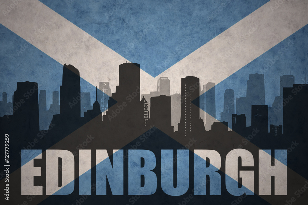 abstract silhouette of the city with text Edinburgh at the vintage scotland flag