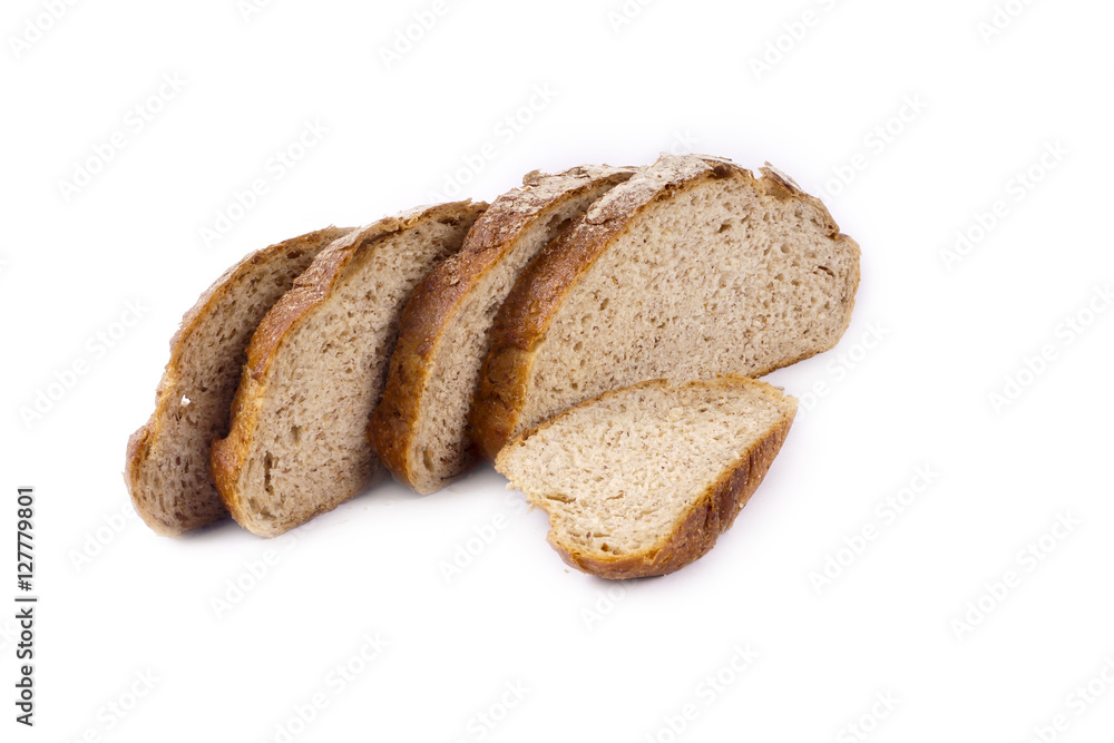 Fresh whole grain bread cut in half on white background