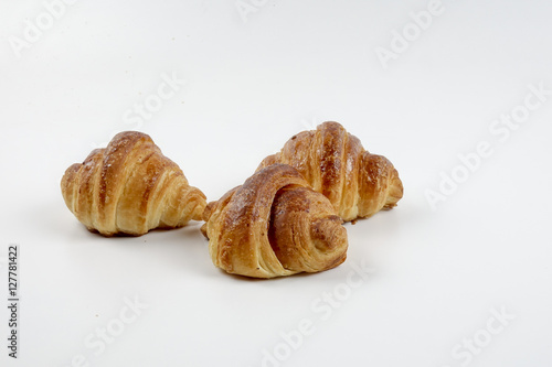 Fresh whole grain bread cut in half on white background