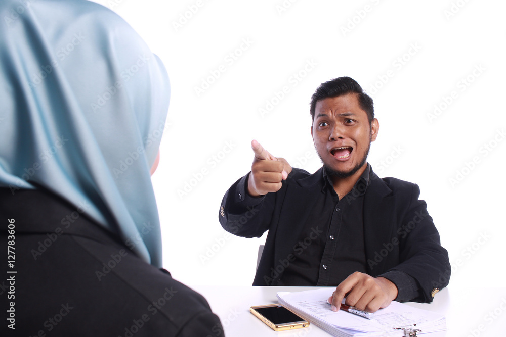 Angry businessman scolding his colleagues Angry businessman scolding his colleagues