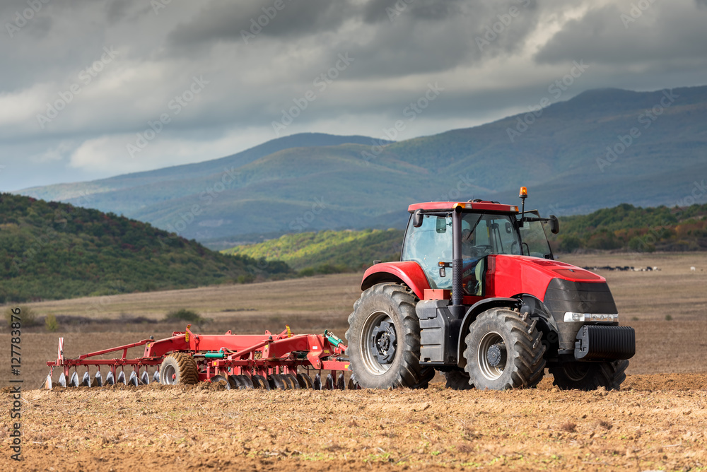 Tractor working on the farm, a modern agricultural transport, a Tractor working on the farm, a modern agricultural transport, a