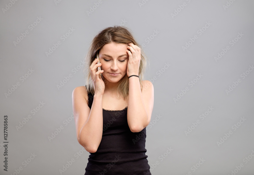 Woman talking mobile phone isolated