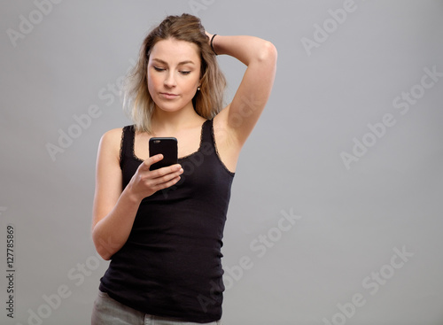 Casual woman using her smartphone