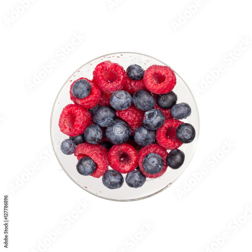 Glass of berries isolated on white background top view flat lay